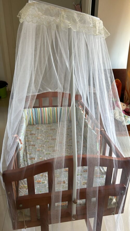 Babyhug Ionia wooden cradle with mosquito net cheery