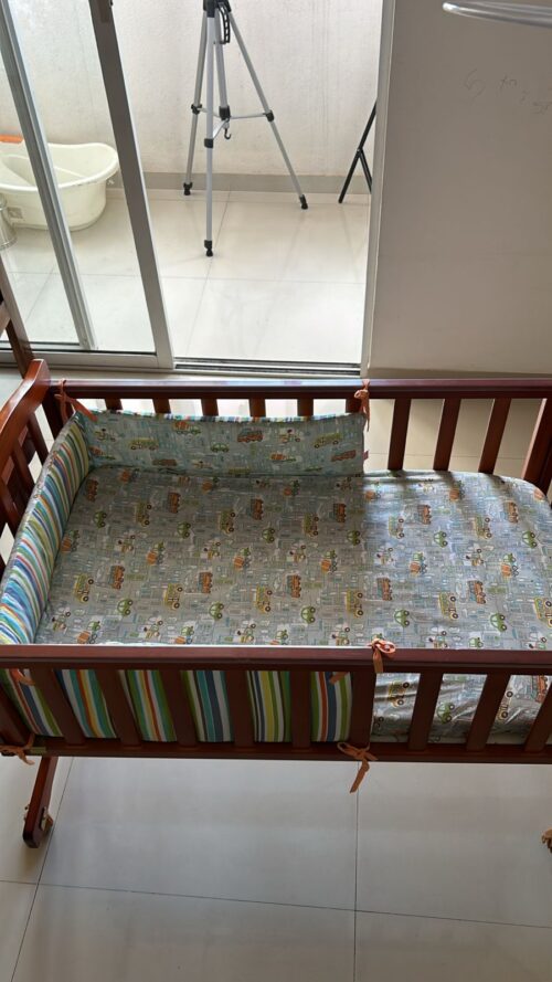 Babyhug Ionia wooden cradle with mosquito net cheery
