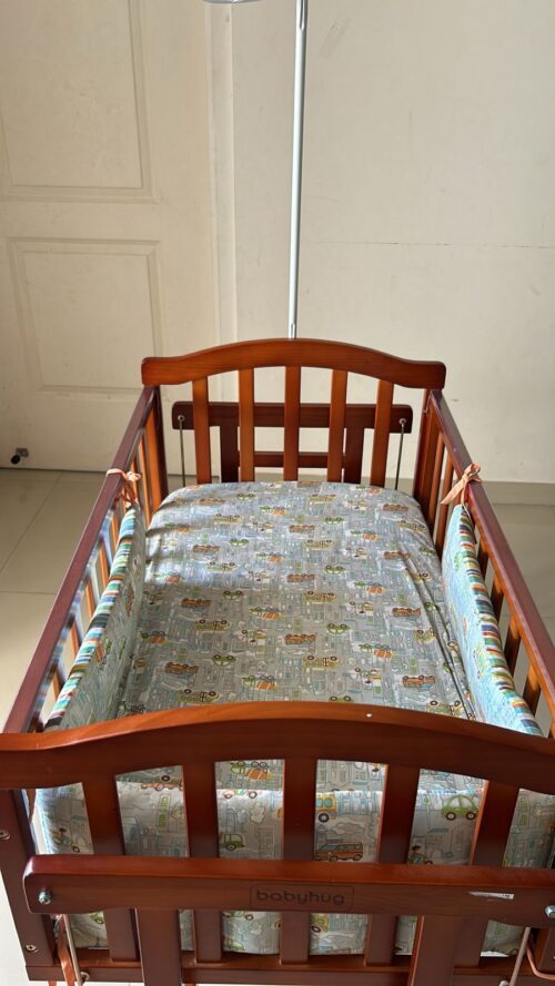 Babyhug Ionia wooden cradle with mosquito net cheery