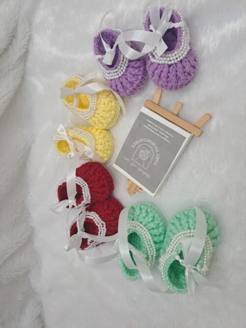Crochet baby girl booties with beads.