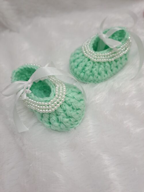 Crochet baby girl booties with beads.