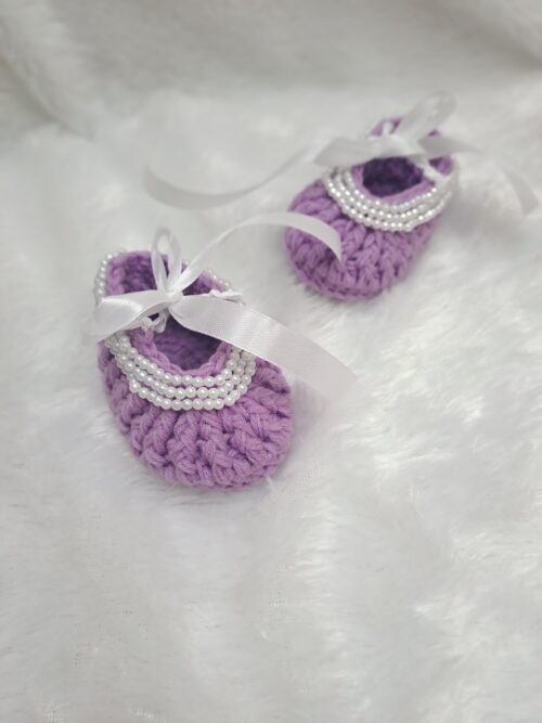 Crochet baby girl booties with beads.